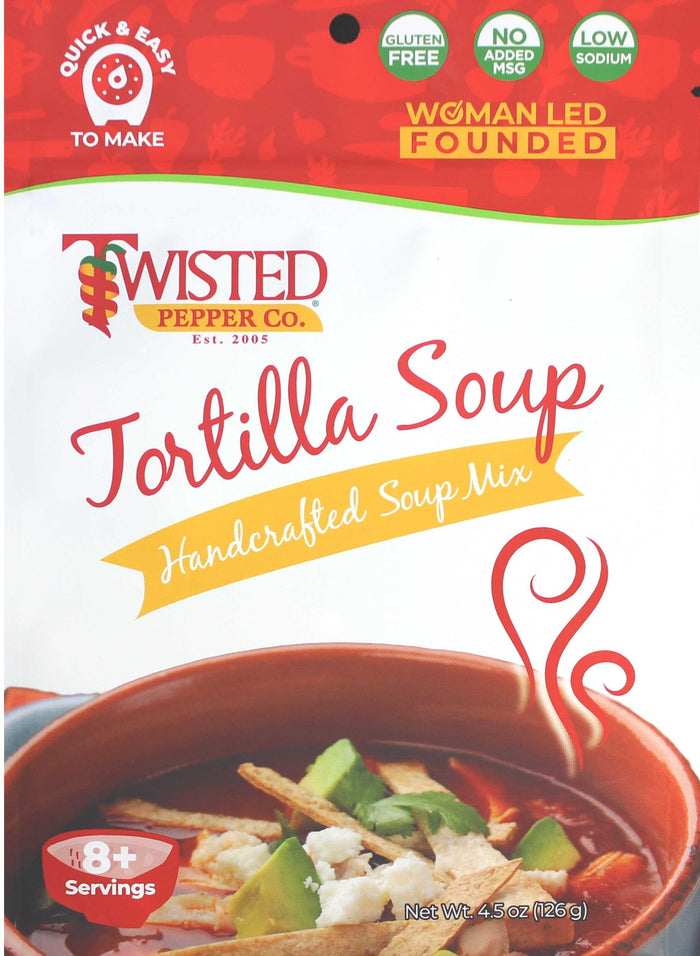 Tortilla Dry Soup Mix with tomatoes, garnished with cheese, lime, and tortilla strips in a bowl