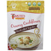 Creamy Cauliflower Dry Soup Mix package with prepared creamy cauliflower soup in bowl garnished with parsley and bacon bits