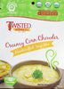 Creamy Corn Chowder soup in a bowl with herbs and bacon bits garnish